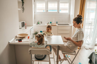 Mother teaching childs during luch time